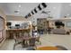 Spacious great room with a bar, stone fireplace, and comfortable seating at 6061 Fairway Ln # 1411, Bradenton, FL 34210