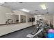 Bright gym featuring mirrored walls, various workout machines, and weights at 6061 Fairway Ln # 1411, Bradenton, FL 34210