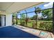 Relaxing lanai with golf course view and decorative rock border, providing a serene outdoor experience at 6061 Fairway Ln # 1411, Bradenton, FL 34210