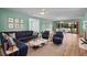 Cozy living room featuring stylish furniture and a view of the screened-in patio at 6061 Fairway Ln # 1411, Bradenton, FL 34210