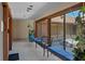 Inviting lobby with bench seating, tile floors, and view of landscaped courtyard at 6061 Fairway Ln # 1411, Bradenton, FL 34210