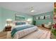 Bright bedroom featuring hardwood floors and a serene, neutral color palette at 6061 Fairway Ln # 1411, Bradenton, FL 34210
