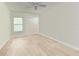 This spacious bedroom features light hardwood floors and a bright, neutral color palette at 6111 Courtside Dr # 61, Bradenton, FL 34210