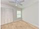Bright bedroom features light hardwood floors, closet, and window at 6111 Courtside Dr # 61, Bradenton, FL 34210