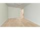 This empty bedroom boasts light hardwood floors and a bright, neutral color palette at 6111 Courtside Dr # 61, Bradenton, FL 34210