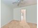 Empty bedroom with light hardwood floors and neutral color palette at 6111 Courtside Dr # 61, Bradenton, FL 34210