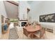 Dining area next to the living room featuring high ceilings and natural light at 6111 Courtside Dr # 61, Bradenton, FL 34210