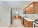 Spacious kitchen featuring stainless steel appliances and wood cabinets, with modern finishes at 6111 Courtside Dr # 61, Bradenton, FL 34210