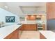 Modern kitchen with a long breakfast bar, stylish cabinets, and stainless steel appliances at 6111 Courtside Dr # 61, Bradenton, FL 34210