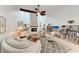 Open-concept living room with vaulted ceiling, fireplace, and lots of natural light at 6111 Courtside Dr # 61, Bradenton, FL 34210