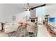 Large living room features a fireplace, vaulted ceiling, and hardwood floors at 6111 Courtside Dr # 61, Bradenton, FL 34210