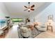 Spacious living room featuring vaulted ceilings, lots of seating, and sliding glass doors at 6111 Courtside Dr # 61, Bradenton, FL 34210
