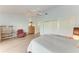 Bright main bedroom with vaulted ceilings, ceiling fan, and a large closet at 6111 Courtside Dr # 61, Bradenton, FL 34210