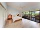 Bright main bedroom with vaulted ceilings, ceiling fan, sliding glass doors and ensuite terrace at 6111 Courtside Dr # 61, Bradenton, FL 34210