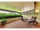 Screened in porch with seating at 6111 Courtside Dr # 61, Bradenton, FL 34210