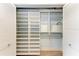 Custom walk-in closet with adjustable shelving and ample storage space at 6111 Courtside Dr # 61, Bradenton, FL 34210