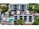 Aerial view of condo rooftop terrace, swimming pool, and surrounding landscape at 626 Rawls Ave # 626, Sarasota, FL 34236