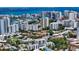 Stunning aerial view captures luxury residences with rooftop pools, set against a backdrop of cityscape and bay at 626 Rawls Ave # 626, Sarasota, FL 34236