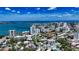 Scenic aerial of urban residences with rooftop pools, complemented by a picturesque waterfront skyline at 626 Rawls Ave # 626, Sarasota, FL 34236