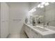 Bright bathroom boasts a double sink vanity, modern lighting, and ample cabinet space at 626 Rawls Ave # 626, Sarasota, FL 34236