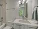 Bright bathroom features a bathtub, sleek vanity and a modern shower head at 626 Rawls Ave # 626, Sarasota, FL 34236