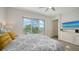 Bedroom with queen size bed, balcony view, and ceiling fan at 626 Rawls Ave # 626, Sarasota, FL 34236