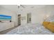 Bedroom featuring queen bed, dresser, and access to bathroom and stairway at 626 Rawls Ave # 626, Sarasota, FL 34236