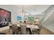Elegant dining room with modern lighting and an open view of the living area at 626 Rawls Ave # 626, Sarasota, FL 34236
