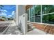Condo entrance with modern architectural design, steps leading to glass door at 626 Rawls Ave # 626, Sarasota, FL 34236