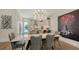 Modern kitchen seamlessly transitions to a dining area, featuring sleek countertops and contemporary design at 626 Rawls Ave # 626, Sarasota, FL 34236