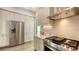 Modern kitchen showcasing stainless steel refrigerator, oven, and white countertops at 626 Rawls Ave # 626, Sarasota, FL 34236
