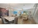 Bright living space blends the dining and living areas, offering an open floor plan with stylish decor at 626 Rawls Ave # 626, Sarasota, FL 34236