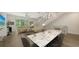 This open living space features modern design with stairs, neutral colors, and a sleek dining area at 626 Rawls Ave # 626, Sarasota, FL 34236