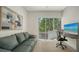 The office room features a sofa, modern desk, comfortable chair and a great view at 626 Rawls Ave # 626, Sarasota, FL 34236