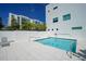 Beautiful community pool with lounge chairs and a contemporary building providing a relaxing atmosphere at 626 Rawls Ave # 626, Sarasota, FL 34236