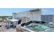 This rooftop deck features a modern grill, dining set, and hot tub overlooking the city at 626 Rawls Ave # 626, Sarasota, FL 34236