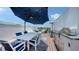 Condo rooftop deck featuring outdoor dining and kitchen with grill at 626 Rawls Ave # 626, Sarasota, FL 34236