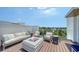 Inviting rooftop deck with a comfortable seating area, fire pit, and stylish decor for relaxing and entertaining at 626 Rawls Ave # 626, Sarasota, FL 34236