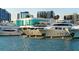 Upscale marina view featuring a collection of luxurious yachts against a backdrop of modern waterfront architecture at 626 Rawls Ave # 626, Sarasota, FL 34236