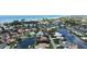 Breathtaking aerial view of a waterfront property featuring a private pool and boat dock with stunning ocean views at 670 Old Compass Rd, Longboat Key, FL 34228
