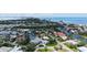 Aerial view of waterfront community featuring beautiful homes and lush landscaping near the coast at 670 Old Compass Rd, Longboat Key, FL 34228