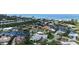 Stunning waterfront home with a private pool and dock, nestled in a lush tropical landscape near the beach at 670 Old Compass Rd, Longboat Key, FL 34228