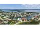 Beautiful aerial view of a waterfront community highlighting numerous homes, canals, and ocean views at 670 Old Compass Rd, Longboat Key, FL 34228