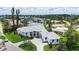 Beautiful waterfront home with lush landscaping, multi-car garage, paver driveway, and close proximity to the water at 670 Old Compass Rd, Longboat Key, FL 34228