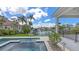Inviting backyard features a beautiful pool, lush landscaping and waterfront views at 670 Old Compass Rd, Longboat Key, FL 34228