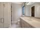 Modern bathroom featuring glass shower, vanity with solid surface counters, and tile floor at 670 Old Compass Rd, Longboat Key, FL 34228