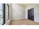 Modern bedroom features a large window and closet at 670 Old Compass Rd, Longboat Key, FL 34228