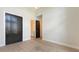 Bedroom featuring closet doors and access to a bathroom and bright, wood floors at 670 Old Compass Rd, Longboat Key, FL 34228