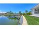 Private boat dock offers direct access to the waterways at 670 Old Compass Rd, Longboat Key, FL 34228