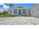 Stunning exterior of home showcasing a landscaped front yard and detailed architecture at 670 Old Compass Rd, Longboat Key, FL 34228
